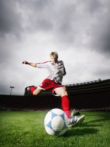 Soccer Player Kicking Ball